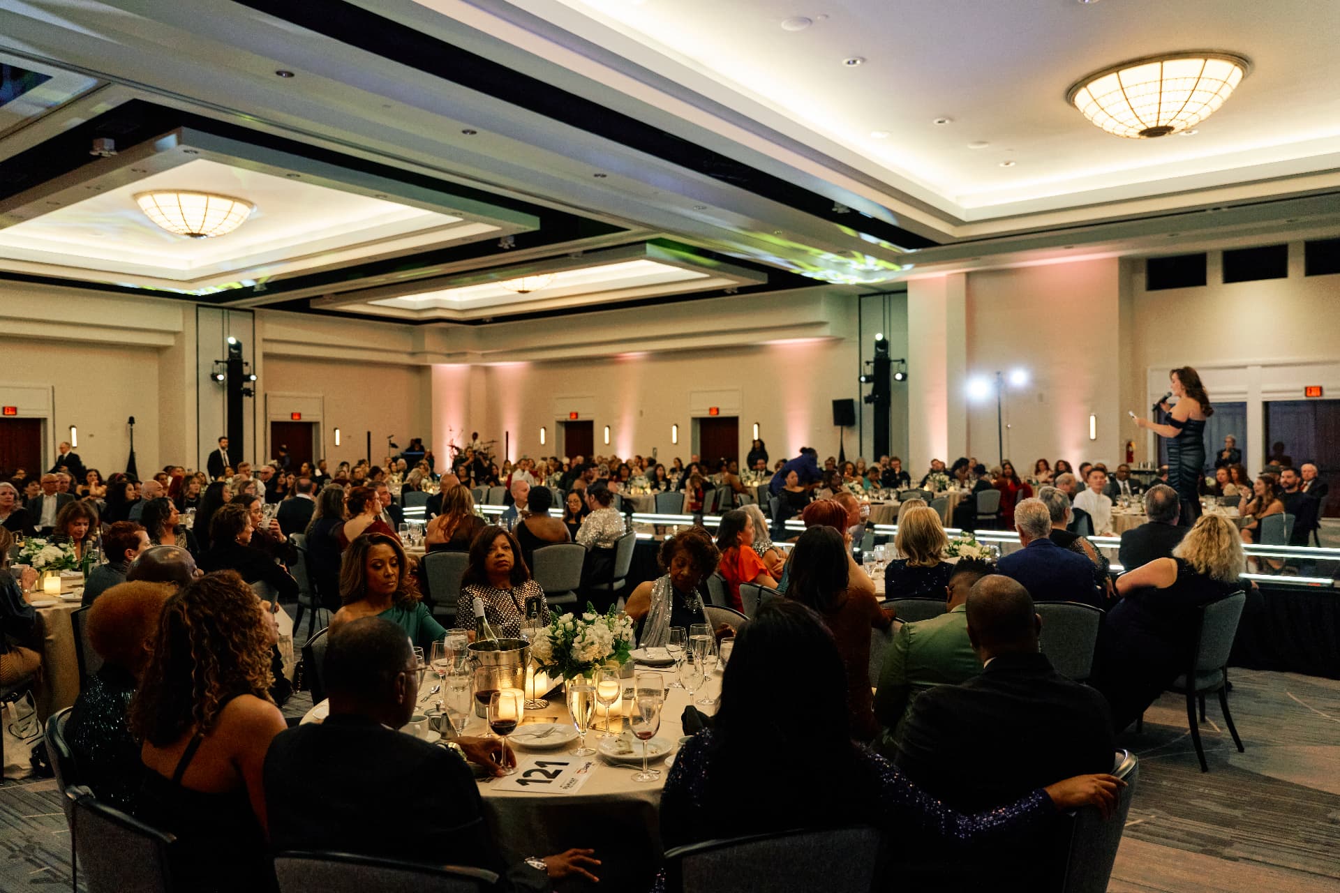 Gala ballroom under warm chandeliers