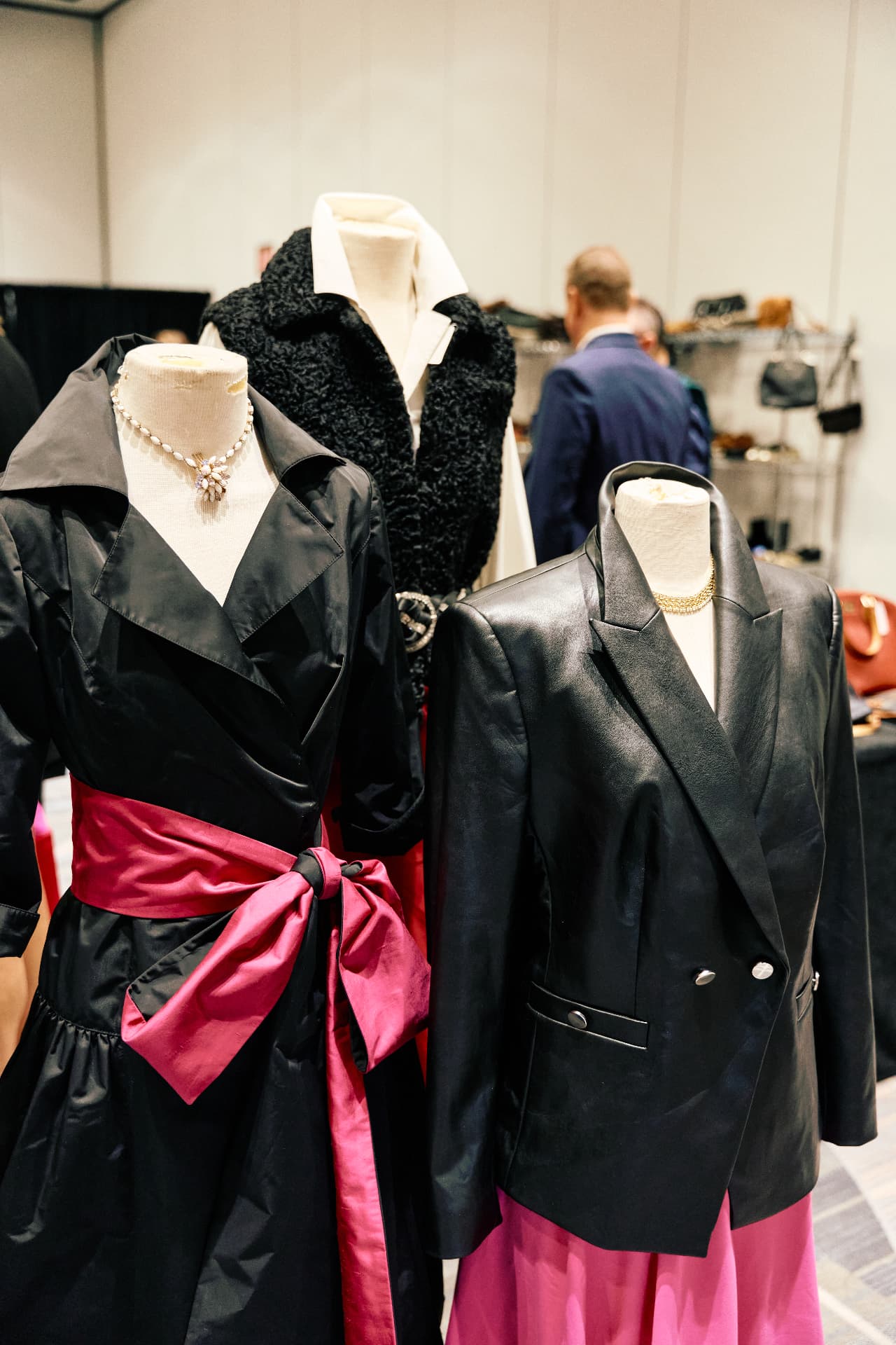 Designer outfits styled on mannequins at the Dress for Success Arizona Designer Sale