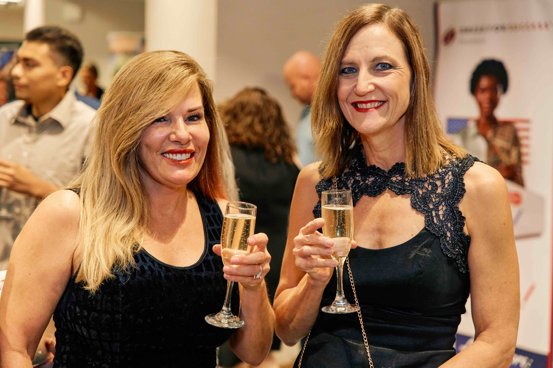 Guests enjoying champagne at the gala