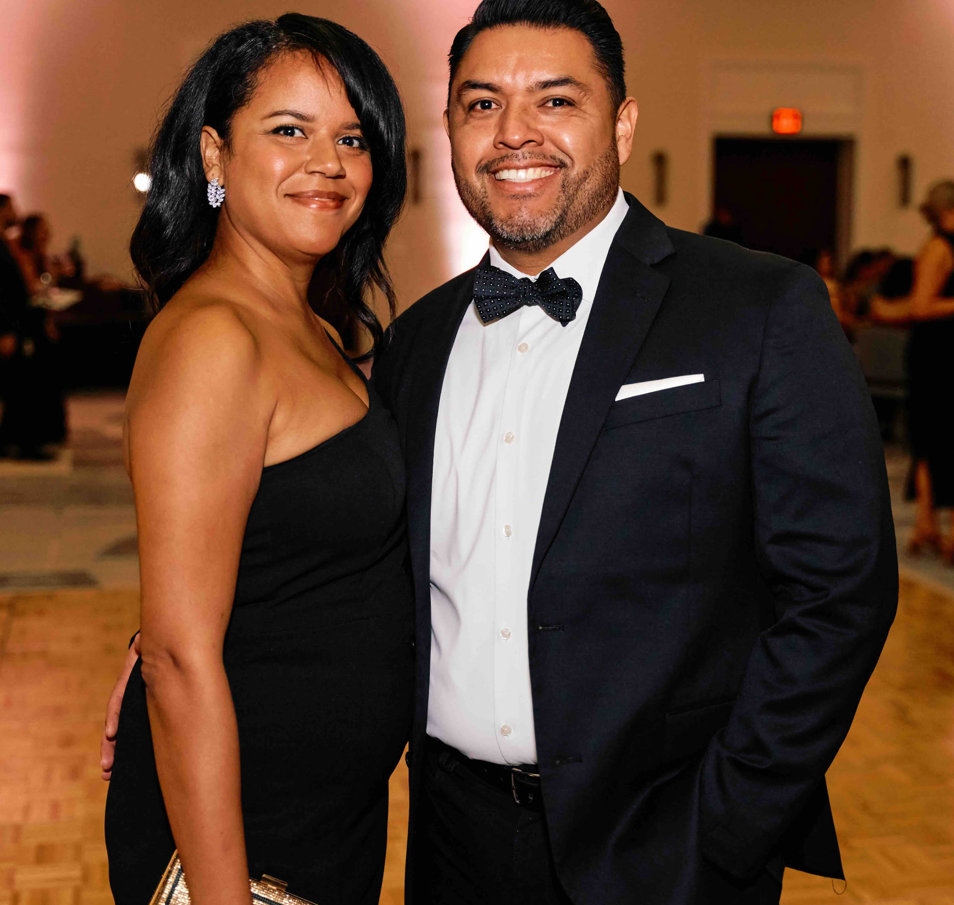 Guests dressed in black-tie attire at the gala